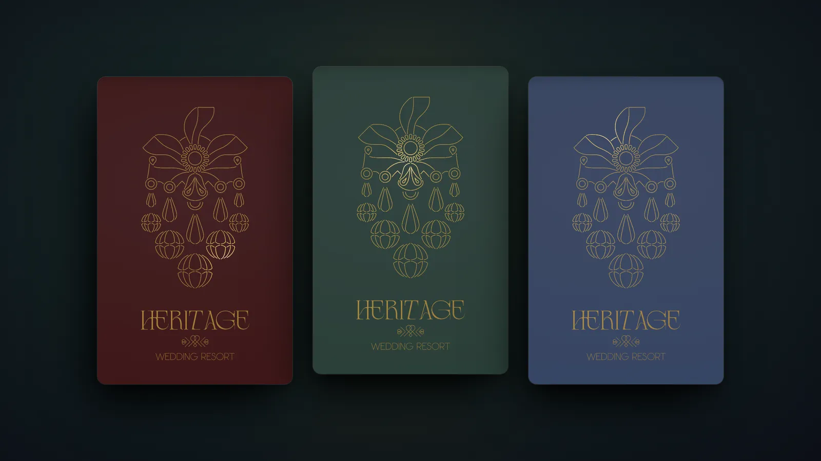 Three Heritage Wedding Resort cards in burgundy, green and blue colourways, each with the gold line-art emblem and the Heritage Wedding Resort wordmark.